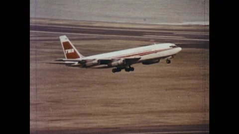 UNITED STATES 1970s: Plane taking off, zoom out, men in control tower / Man Stock Footage