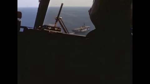 UNITED STATES - 1971 - Copilot at controls of a helicopter. USS Guadalcanal Stock Footage 308104521