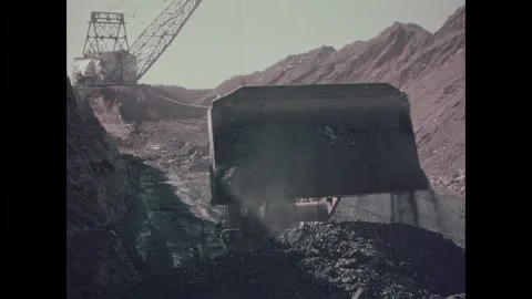 UNITED STATES - 1972 - A mining dozer dumps overburden soil in the mine. Acids Stock Footage 301528319