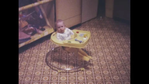 United States 1975 Baby in Walker at Ho. Stock Video Pond5