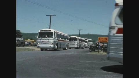 UNITED STATES - 1975: Coach queue - A queue of chartered coaches noses Video stock 344003241