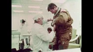 United States: 1981: Scientist Helps Astronaut Into Space Suit. Astronauts Being Stock Footage