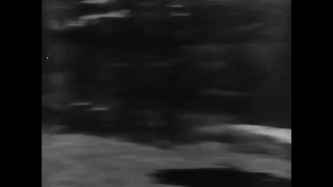 A United States Army soldier use rope slings to ascend a cliff, in a mountain Stock Footage