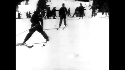 United States Army trainees learn how to snowplow while skiing, in the snow, in Stock Footage 79421340