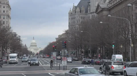 The United States Capitol building and traffic street by day, Washington DC, USA Stock Footage