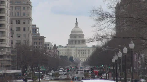 The United States Capitol building and traffic street by day, Washington DC, USA Stock Footage