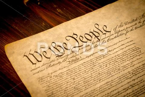 The united states constitution on a wooden desk Stock Photos