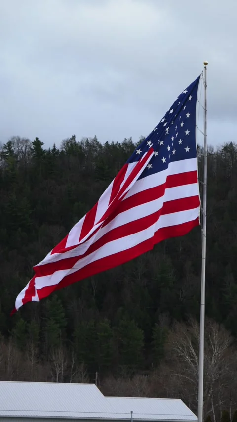 The United States flag, featuring 50 white stars on a blue canton and 13 al.. Stock Footage 342556158