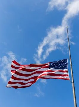 United States flag flying at a half-staff Stock Photos