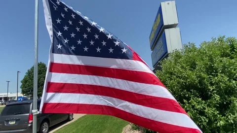 United States Flag in the Wind - Flag  - Bright Sun and Blue Sky Stock Footage 197333620