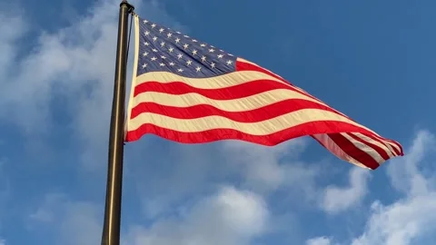 United States Flag in the Wind - Flag  - Bright Sun and Blue  - Close Up Stock Footage 203976229