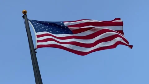 United States Flag in the Wind - Flag  - Bright Sun and Blue Sky Stock Footage 208953602