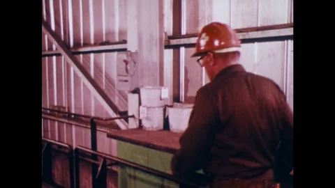 UNITED STATES: Man pulls lever and places lock on it with DANGER tag. Stock Footage 75199054