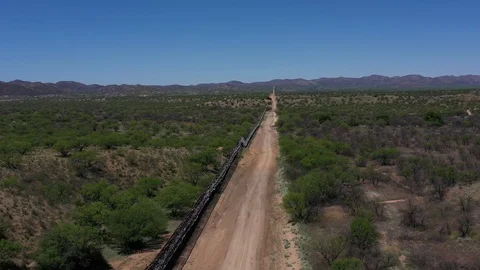 United States Mexico border wall at Sasabe, Arizona Stock Footage