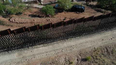 United States Mexico border wall at Nogales Stock Footage