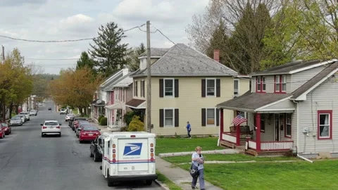 United States Postal Service mail carrier, US Mail truck in small town Stock Footage