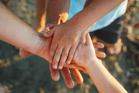 Unity and Support in Shared Hands Gesture Stock Photos