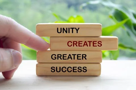 Unity concept shown with wooden blocks symbolizing teamwork collaboration a.. Stock Photos
