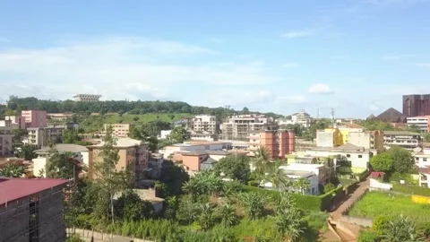 UNITY PALACE AERIAL VIEW 4K WITH URBAN YAOUNDE TRAFFIC DURING THE DAY Stock Footage 165712459