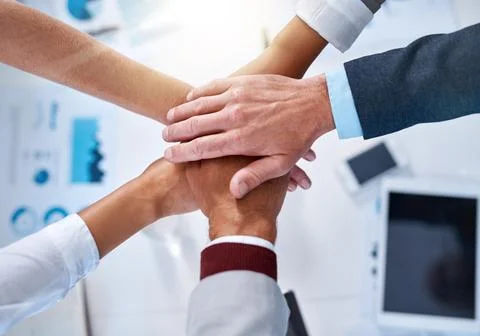 Unity is their greatest advantage. a group of unrecognizable businesspeople Stock Photos