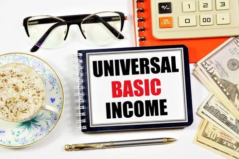 Universal basic income. A text label in the planning notebook. Stock Photos