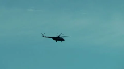 Universal helicopter MI-8 carries the cargo highly in the sky Video stock 10592459