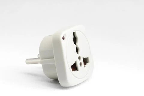 Universal plug adapter on white background. Stock Photos