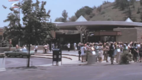 Universal Studios - 1973: group of visitors in queue wait by studios entrance Stock Footage 219787379