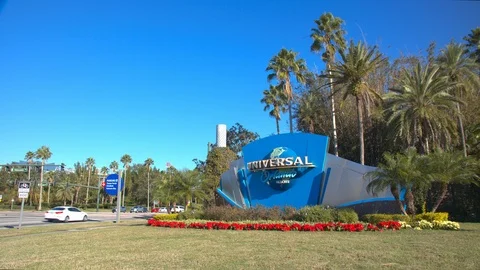 Universal Studios Orlando Resort Street Entrance Sign and Garden Stock Footage