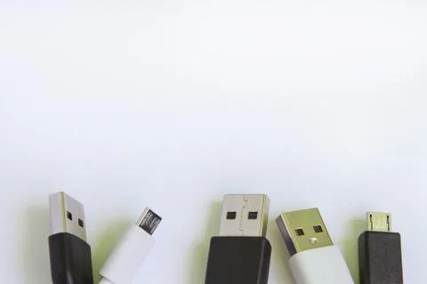 Universal USB cable in white and black for mobile phones. for connecting micr Stock Photos