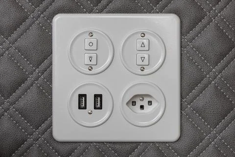 Universal wall light switch and power socket. Stock Photos