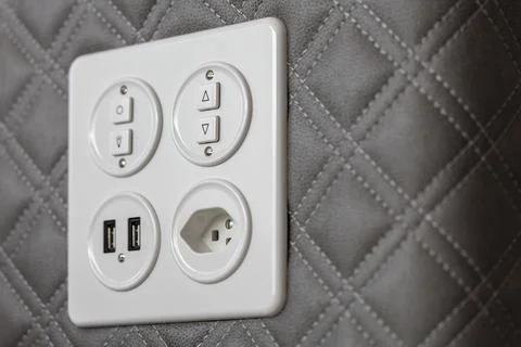 Universal wall light switch and power socket Stock Photos