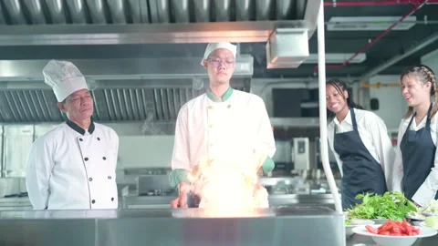 University professor is passing on the knowledge of cooking to students Stock Footage 256000388