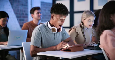 University, shock or friends in class with tech, test results or wow reaction at Stock Footage 336302051