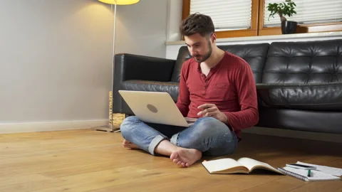 University student learning at home doing notes Stock Footage 162469536