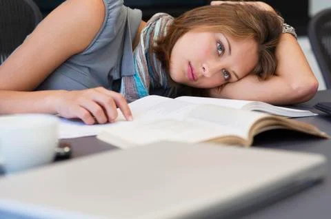 University student looking tired while studying Stock Photos
