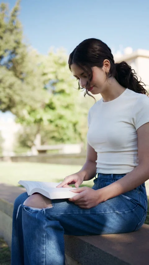 University student reading in slow motion in granada Stock Footage 320338013