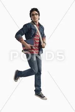 University student running with books and bag Stock Photos