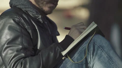 University Student Taking Notes in a Book – Side View Stock Footage 304972979