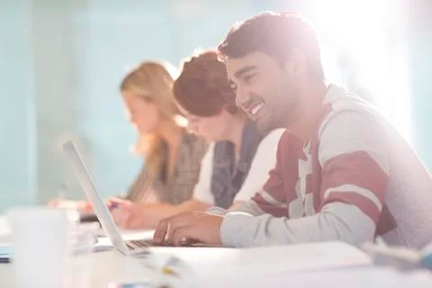 University student using laptop in classroom 스톡 사진