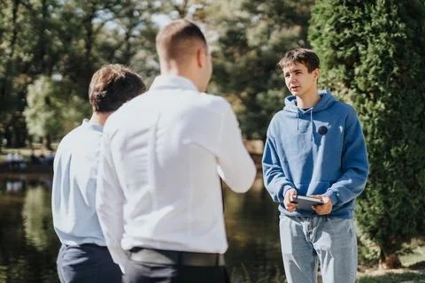 University Students Collaborating and Learning Together in a Sunny Park Stock Photos