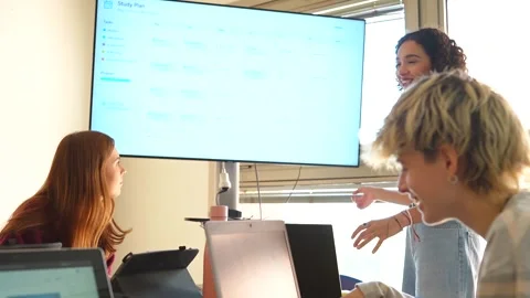 University students collaborating on a telecommunications engineering project Stock Footage 347893451