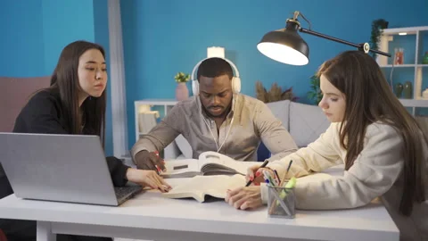 University students of different races study in harmony at home. Stock Footage 228804343