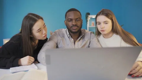 University students of different races working on laptop. Stock Footage 228803483
