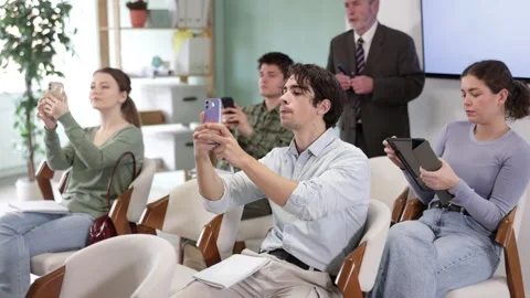 University students scan the qr code during a lecture in front of a qualified Stock-Footage 347559330