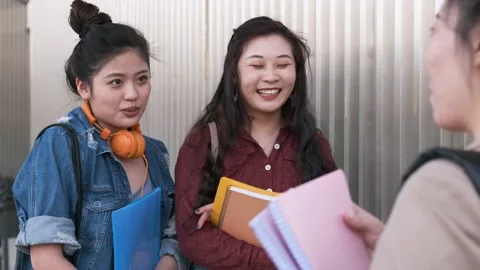 University students talking and having fun together after having classes on t Stock Footage 152098039