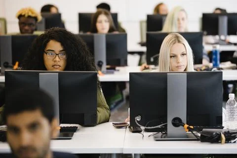 University students using desktop computers at univerity Stock Photos