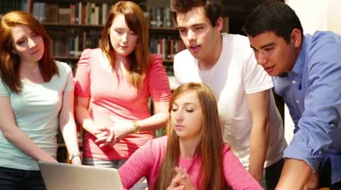 University students working together in the library Stock Footage 22385185
