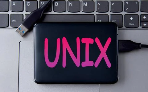 UNIX - acronum on an external drive in gray letters on the background of a .. Stock Photos
