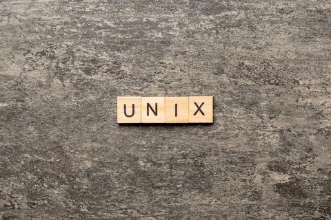 Unix word written on wood block. Unix text on table, concept Stock Photos